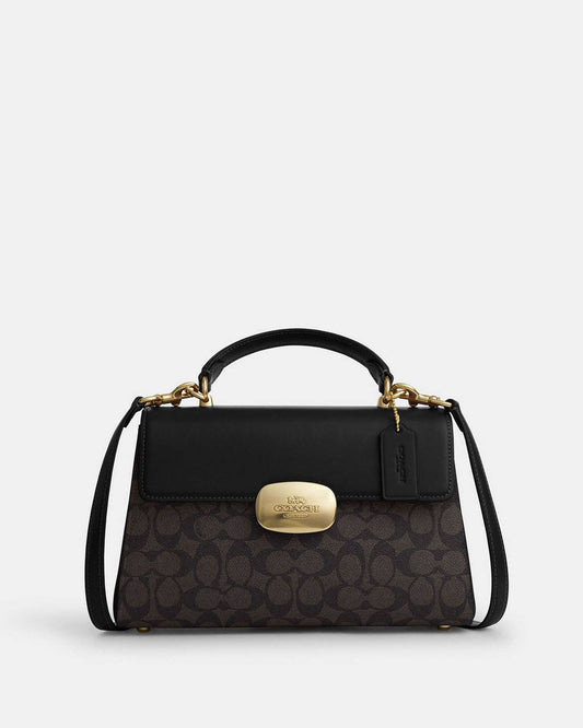 حقيبة "كوتش" (Coach) اليدوية الفاخرة - تصميم Signature Canvas مع قفل معدني ذهبي