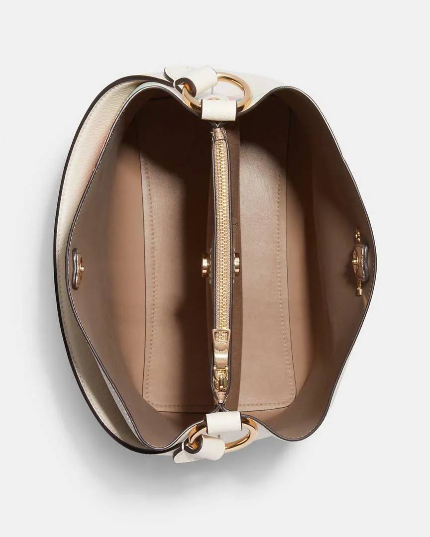 حقيبة "كوتش" (Coach) باكت (Bucket Bag) - بتصميم الزهور الربيعية الأنيق باللون الكريمي