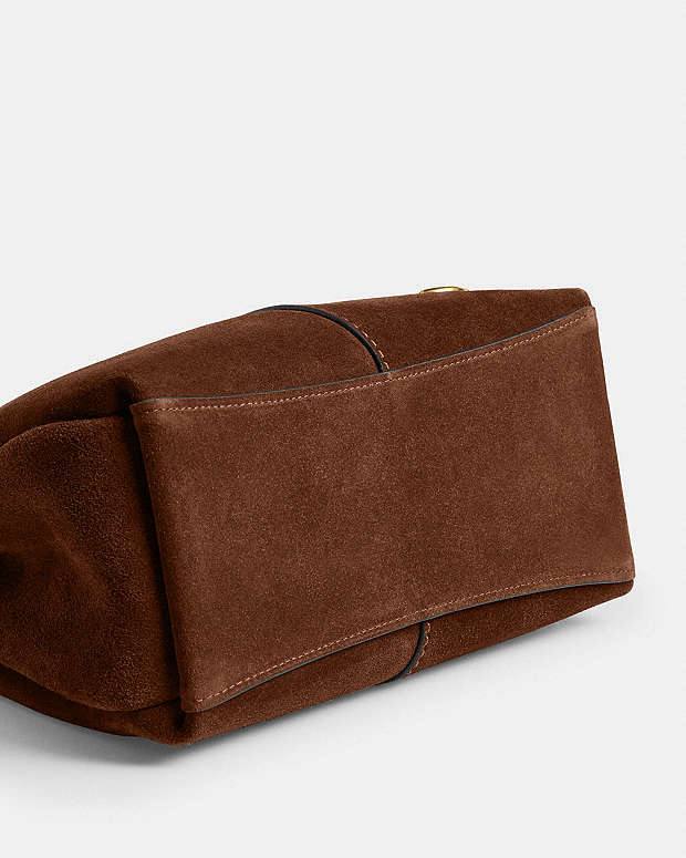 شنطة كوتش (Coach) الأصلية من الشمواه الفاخر – بتصميم عصري أنيق
