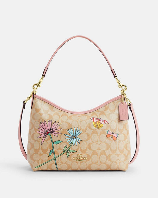حقيبة "كوتش" (Coach) هوبو - تصميم Signature Canvas بنقشة الزهور والفراشات المميزة