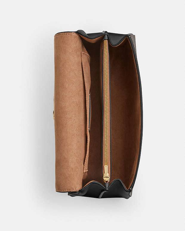 حقيبة "كوتش" (Coach) اليدوية الفاخرة - تصميم Signature Canvas مع قفل معدني ذهبي