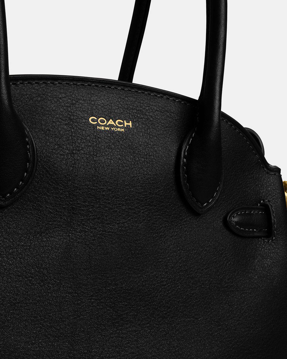 حقيبة "كوتش" (Coach) اليدوية الفاخرة - تصميم الجلد الأسود الكلاسيكي مع تفاصيل ذهبية