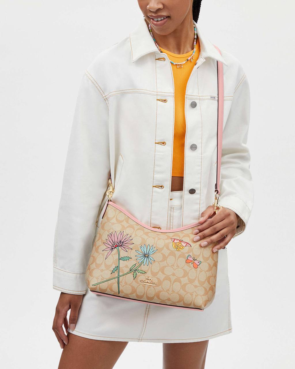 حقيبة "كوتش" (Coach) هوبو - تصميم Signature Canvas بنقشة الزهور والفراشات المميزة