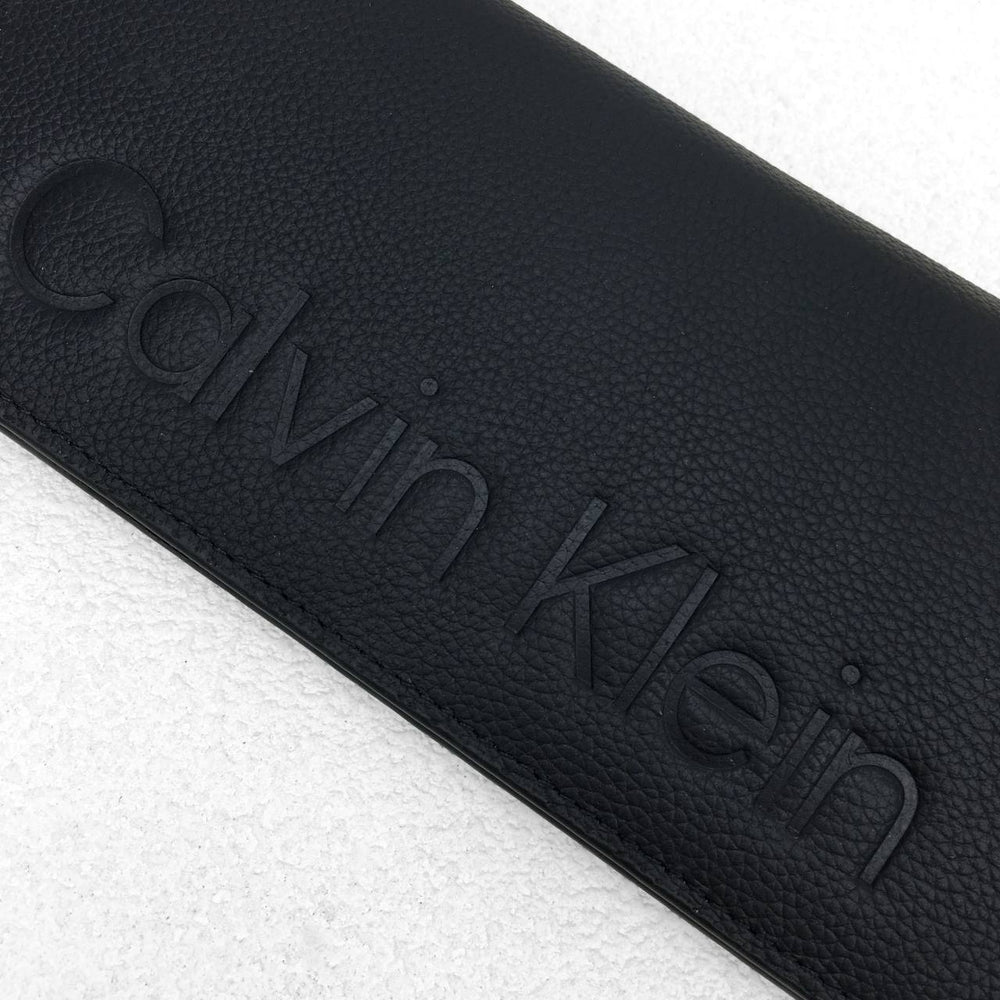 Calvin Klein Unisex Embossed Logo Around Long Wallet