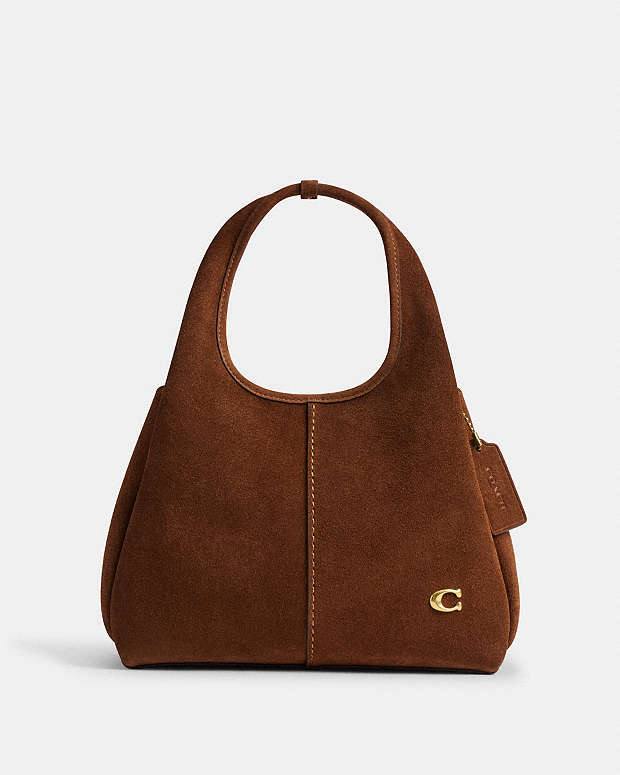 شنطة كوتش (Coach) الأصلية من الشمواه الفاخر – بتصميم عصري أنيق